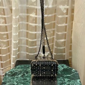 Black coctale  crossbody bag with scull and rings